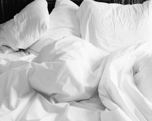 Comfortable bedding indicating restful sleep