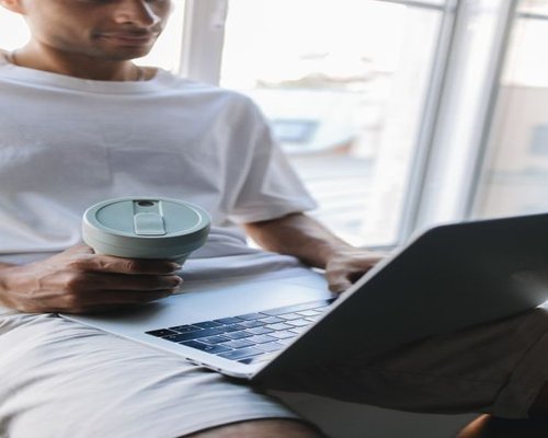 A person taking a short break from their laptop